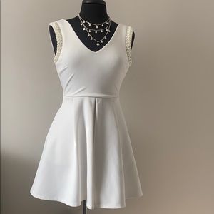 Cocktail Dress with Pockets and pearl neck detail